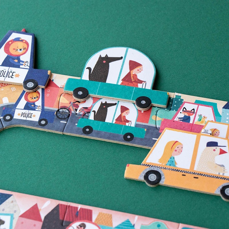 Children's puzzle with toy cars and figures on a green background