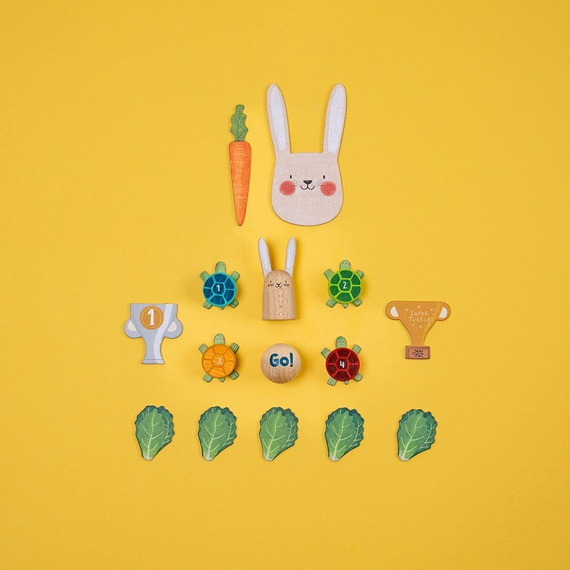 Collection of colorful wooden toys on a yellow background