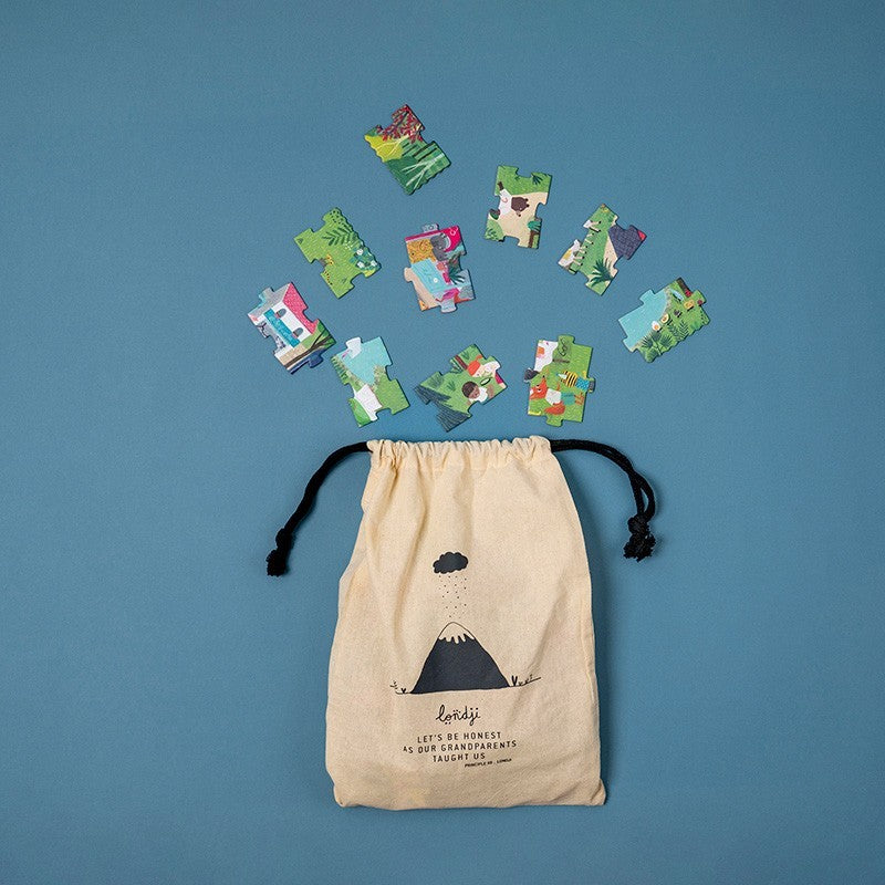 Drawstring bag with puzzle pieces on a blue background