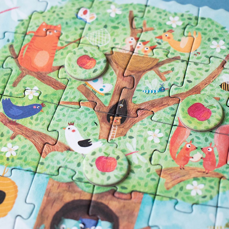 Children's puzzle with animal-themed design on a tree