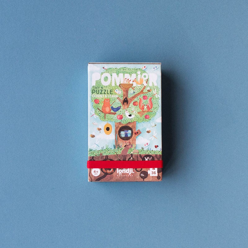 Pommier puzzle box with colorful design on a blue background