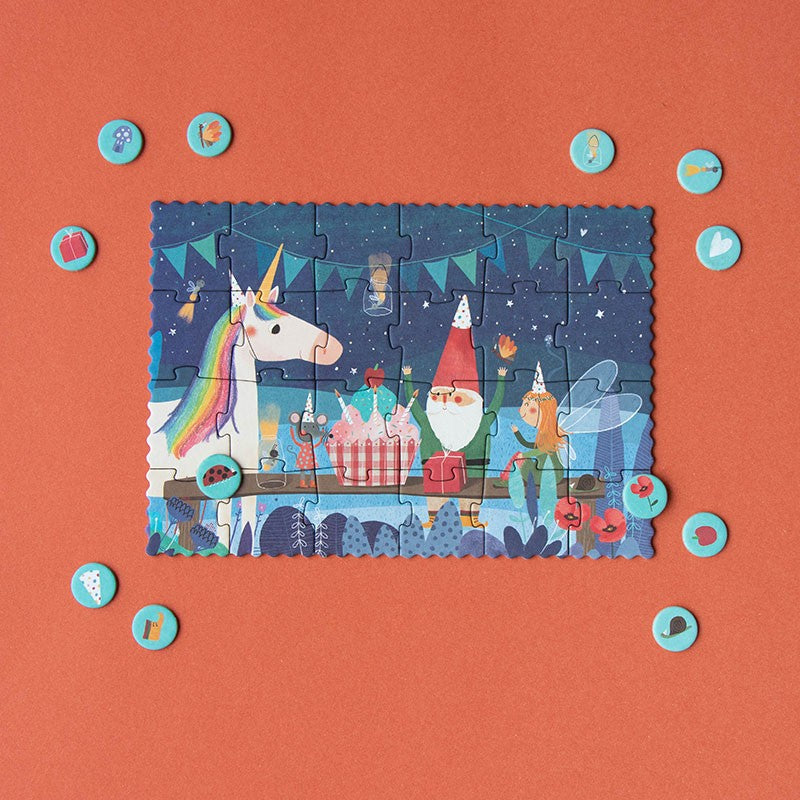 Children's puzzle with a unicorn and fairy design on an orange background