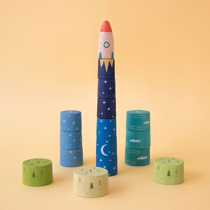 Children's educational game with numbered tokens and rocket ship on a yellow background