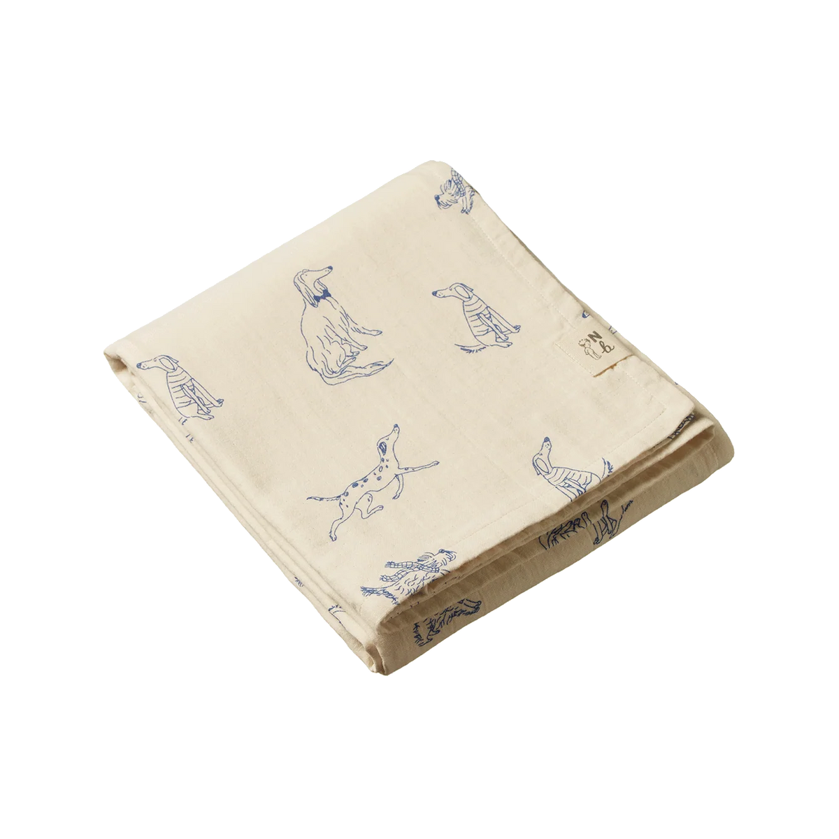 Beige blanket with blue dog illustrations on a white background