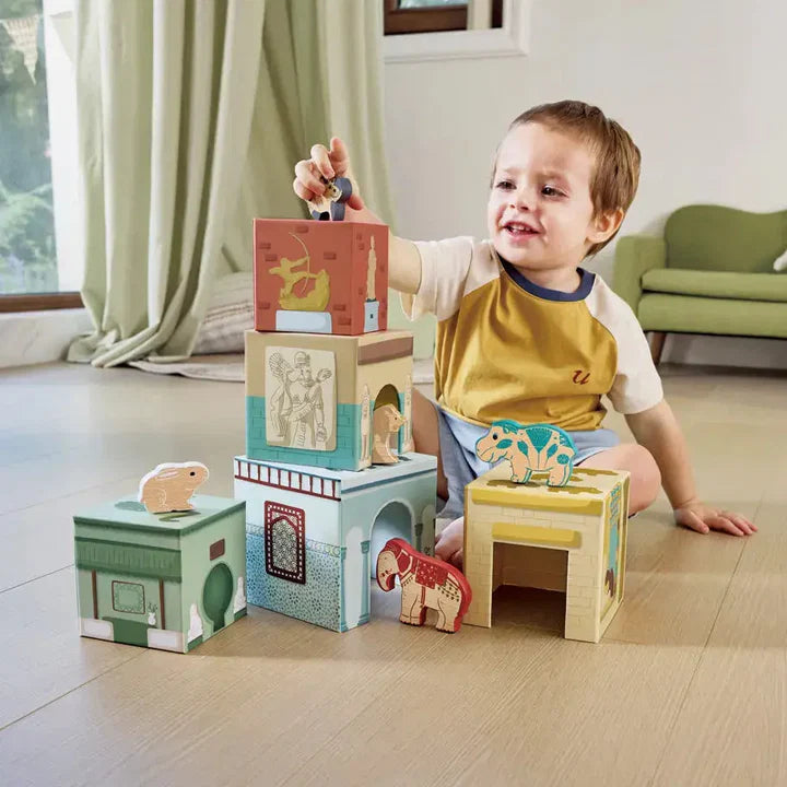 Set of wooden toy blocks with animal figures on a white background