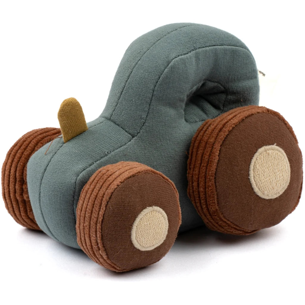 Toy car made of fabric with a green body and brown wheels on a white background