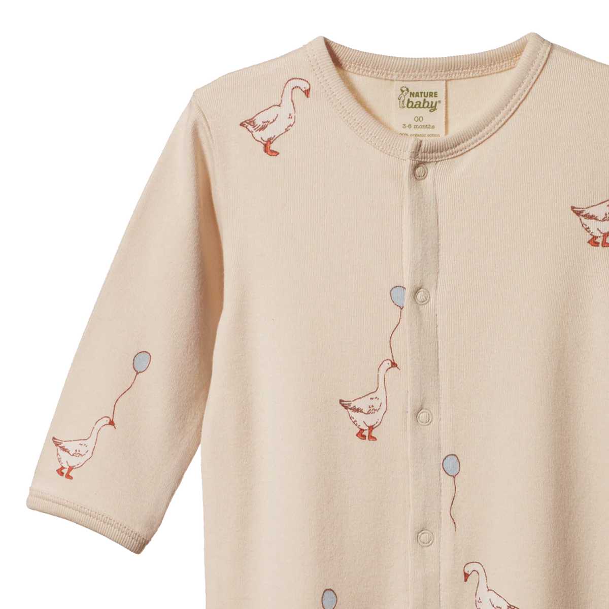 Beige baby one piece with duck pattern on a white background