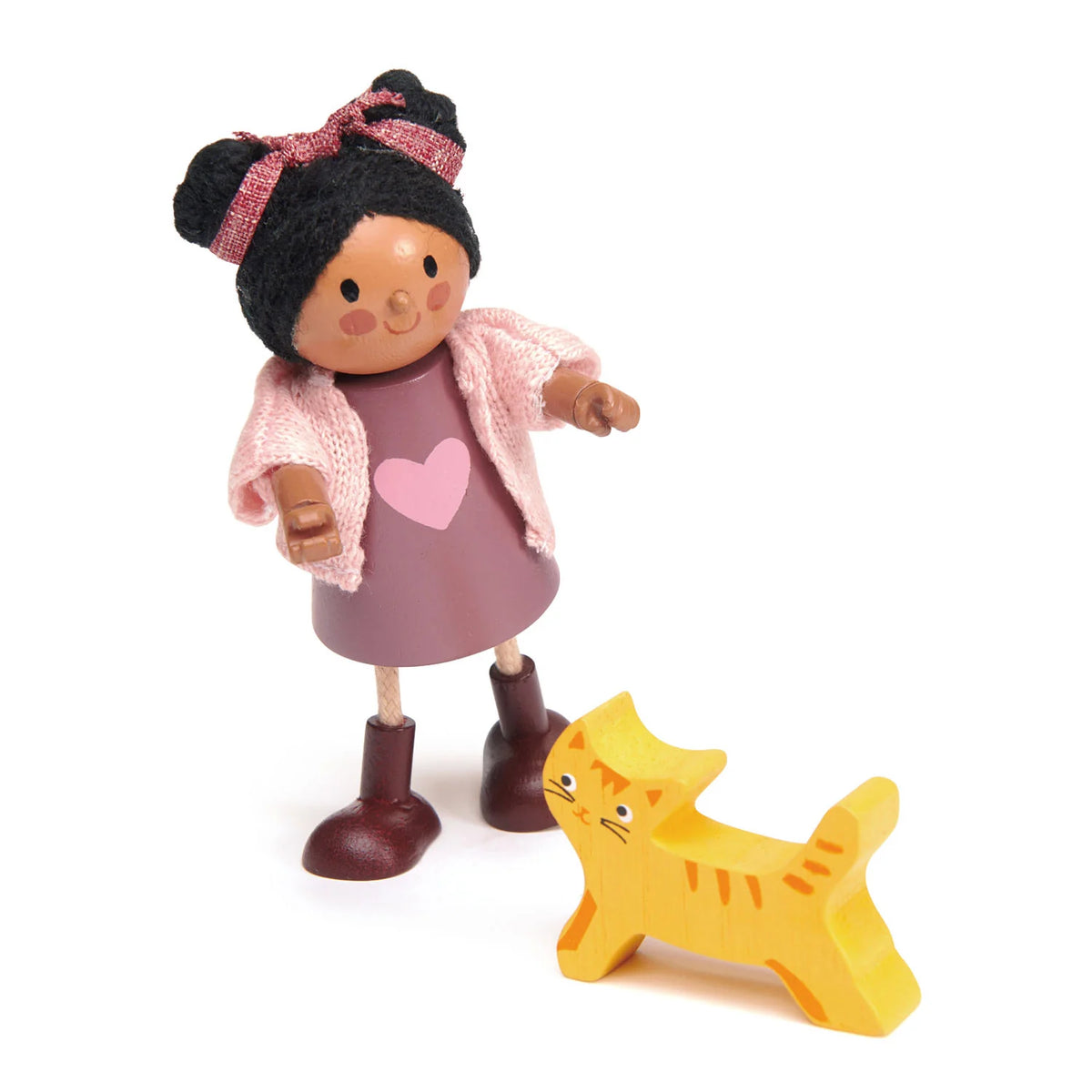 Toy figure of a girl with a pink heart dress and a yellow cat on a white background