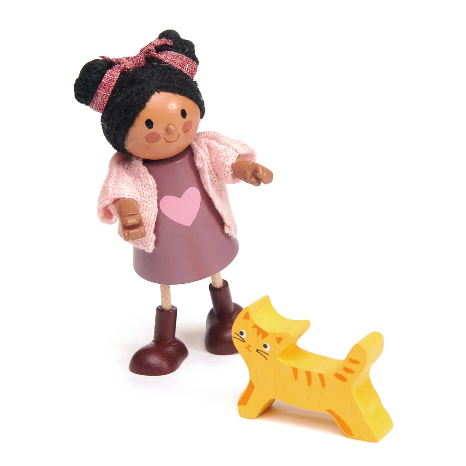 Toy figure of a girl with a pink heart dress and a yellow cat on a white background