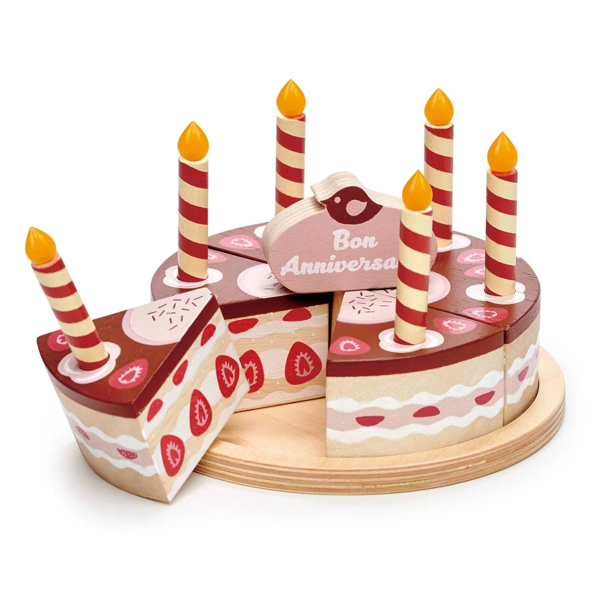 Wooden birthday cake toy with candles and 'Bon Anniversaire' sign on a white background