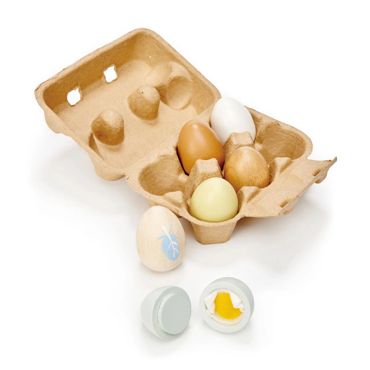 Cardboard egg carton with wooden eggs on a white background