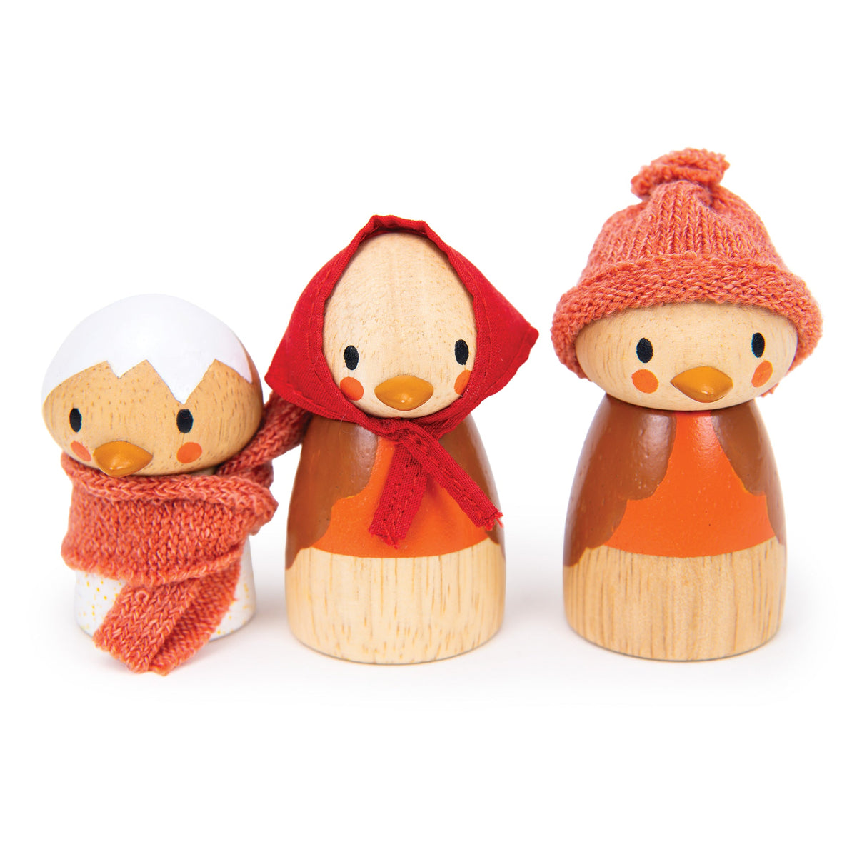 Three wooden duck toys with autumn-themed accessories on a white background