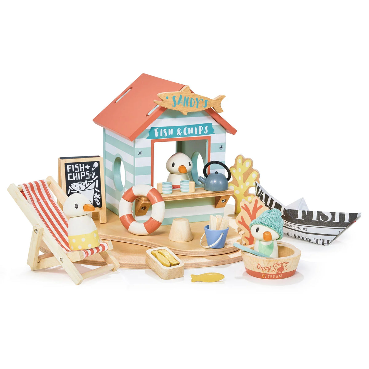Toy set with a fish and chip shop, deck chair, and penguins on a white background