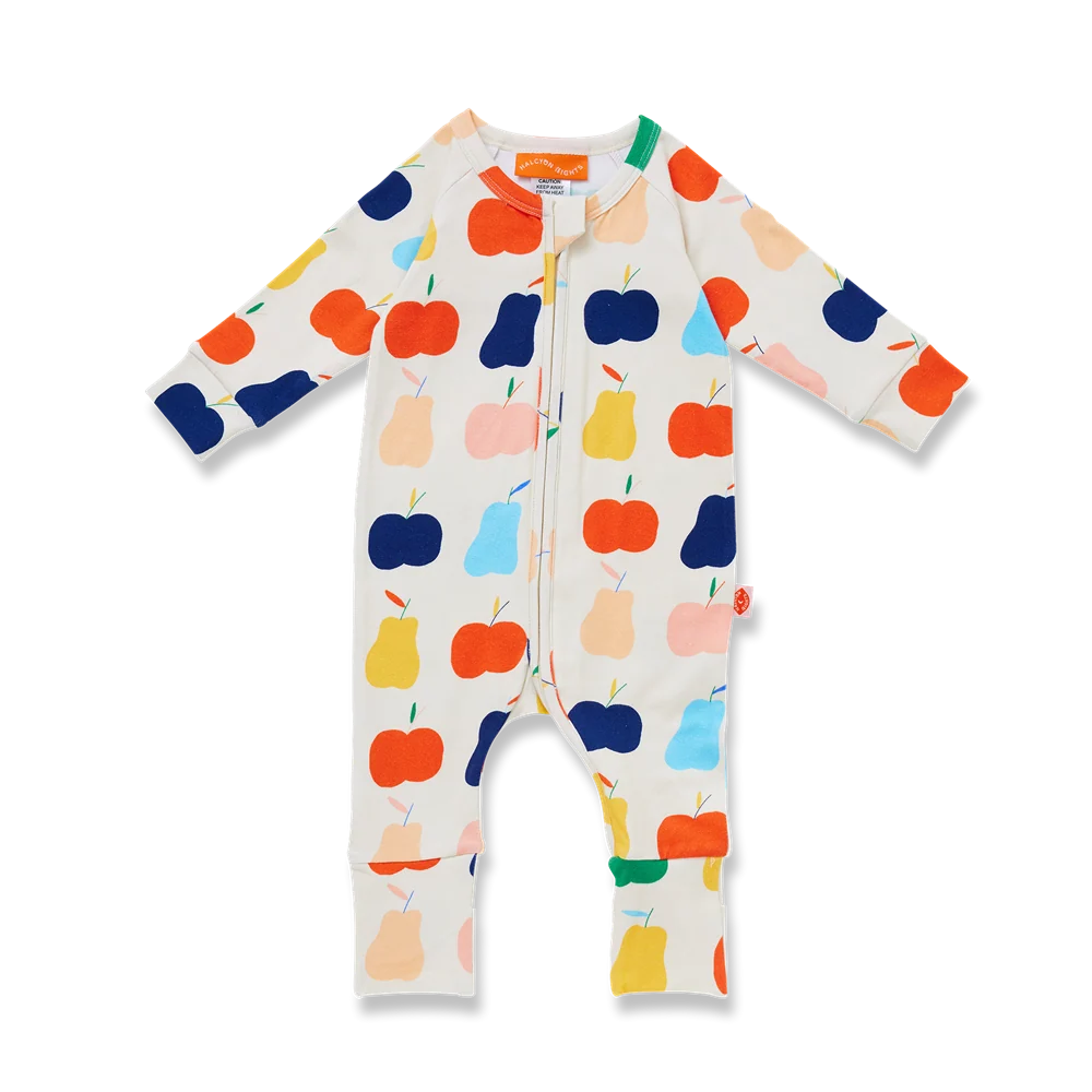 A baby long-sleeve footless one-piece sleeper with a colorful fruit print on an off-white background. The print features stylized apples and pears in orange, yellow, light blue, dark blue, and peach.