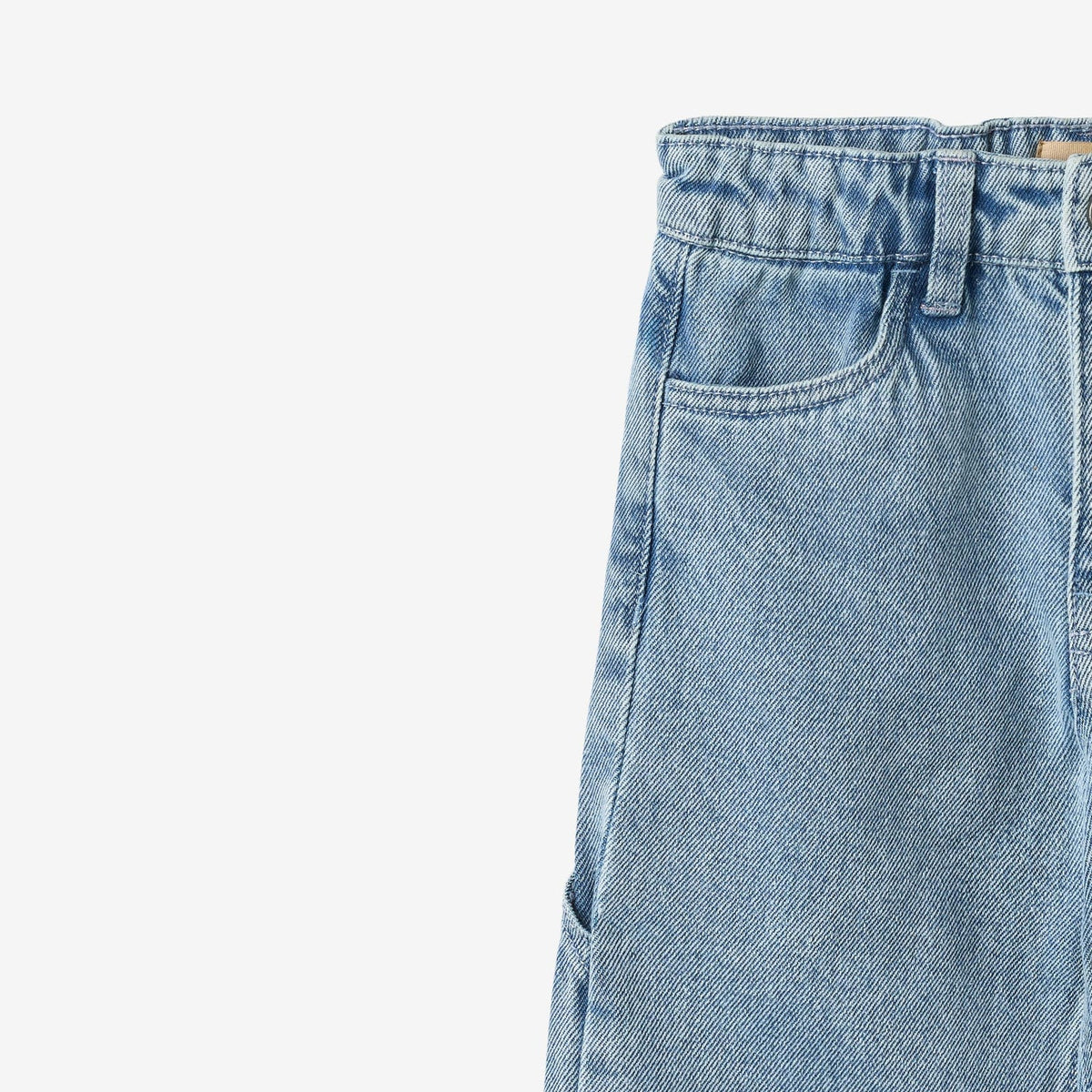 Close-up of a light blue denim pant on a white background