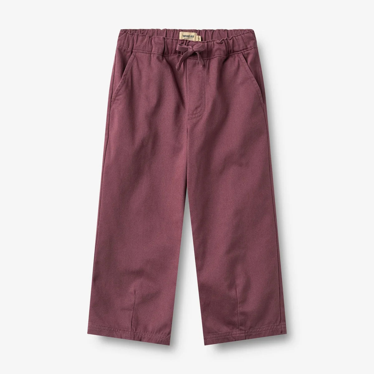 A pair of dusty rose colored cropped pants with an elastic waistband and drawstring, shown flat on a light gray background.