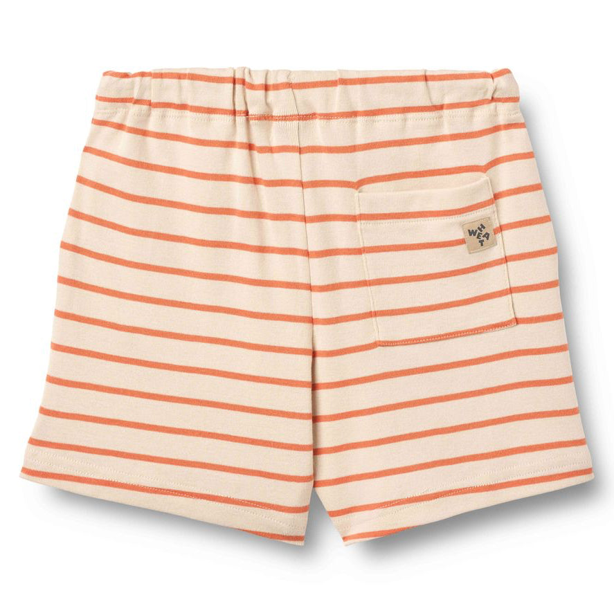 Striped shorts with orange and white stripes on a white background
