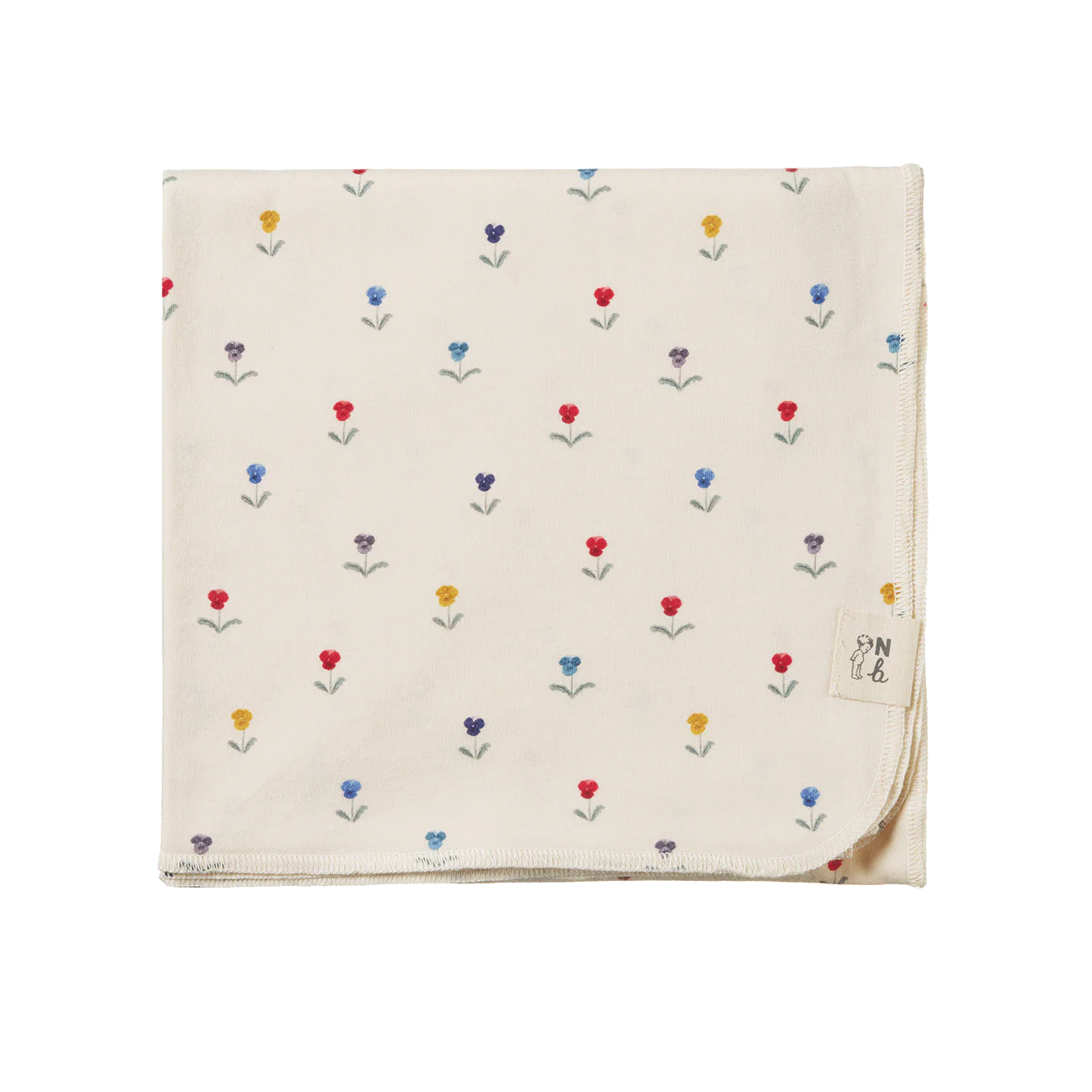 Rolled-up cream-colored fabric with small colorful patterns on a white background