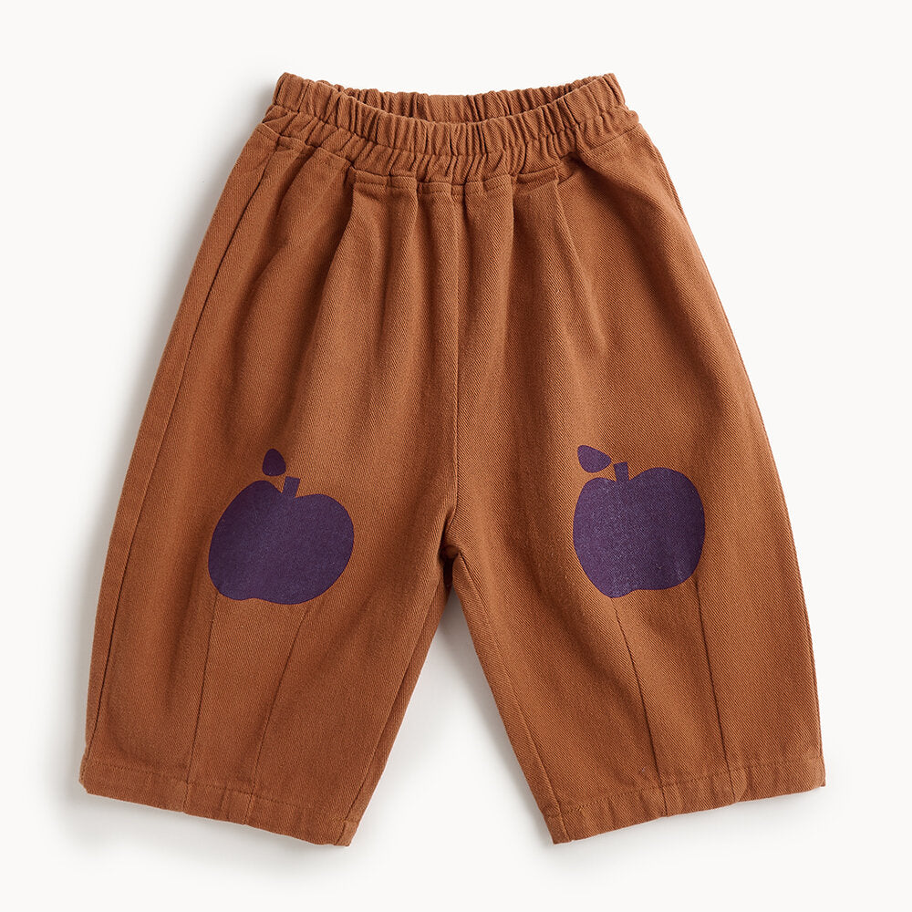Brown pants with purple apple designs on a white background