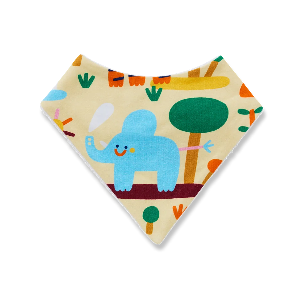 A triangular baby bandana bib with a colorful elephant and tree pattern on a cream background, shown on a plain white background.