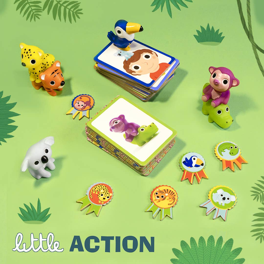 Children's educational toys with animal figures and cards on a green background