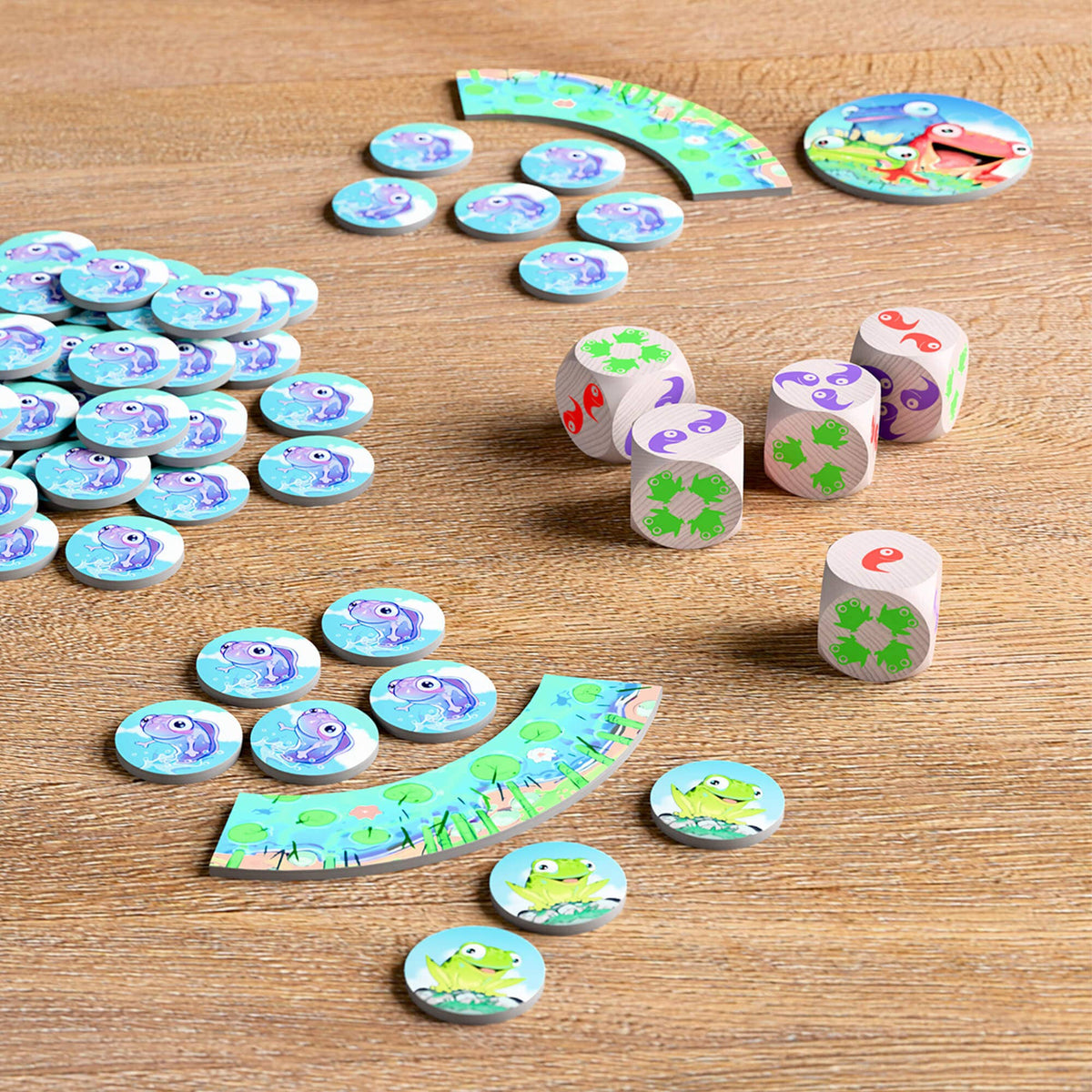Children's board game with dice and game pieces on a wooden surface
