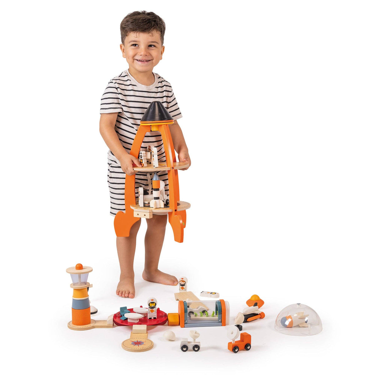 Child playing with a wooden toy set on a white background