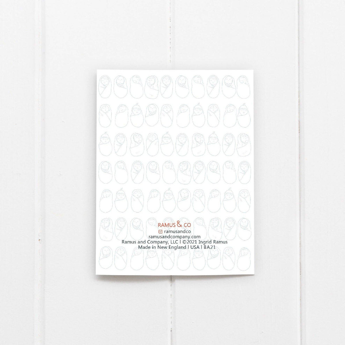 White product packaging with subtle pattern and 'Ramus & Co' branding on a light gray background