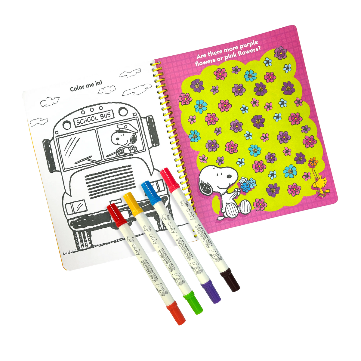 Coloring book set with school bus coloring page, markers, and a notebook with floral design on a white background.