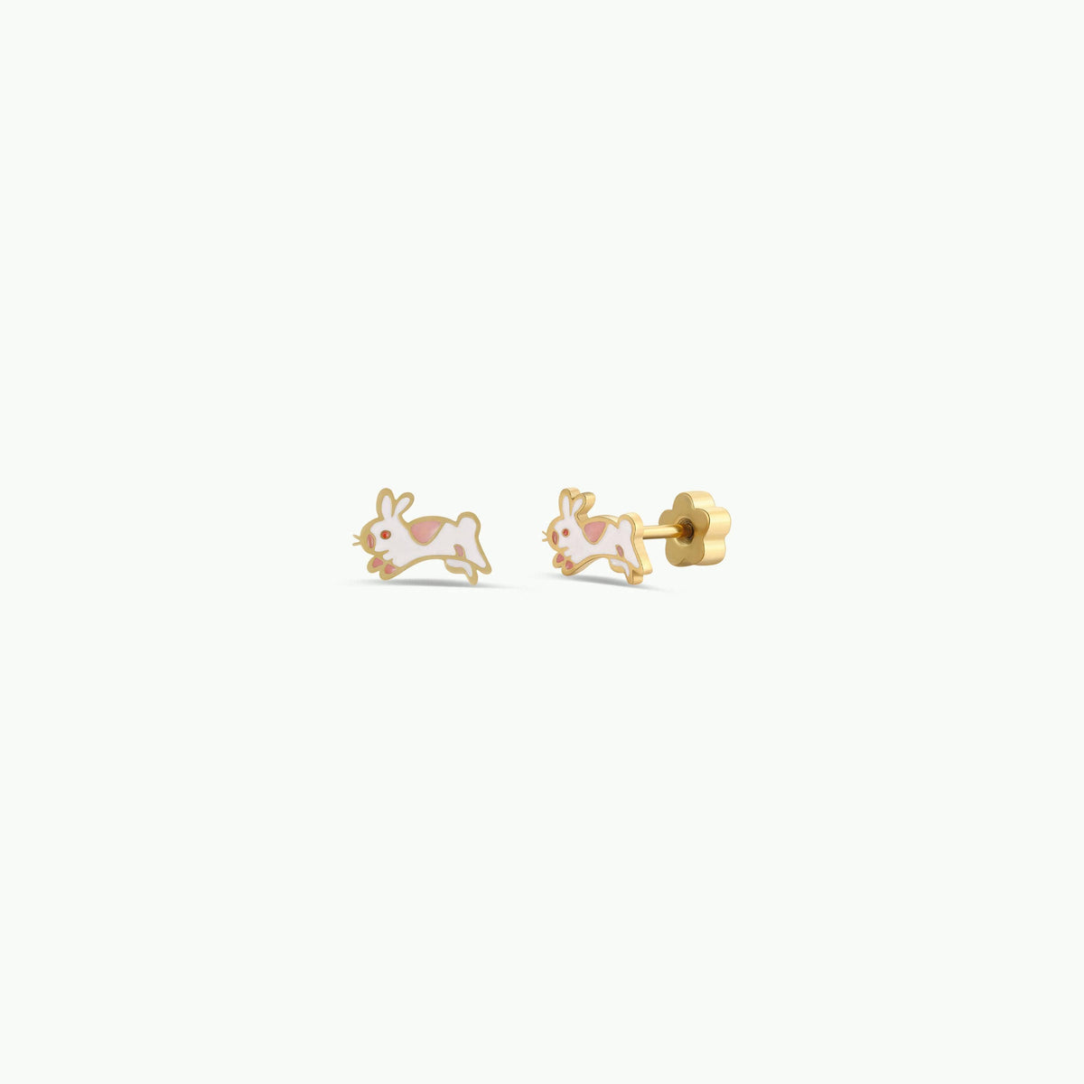 Gold bunny-shaped earrings on a white background