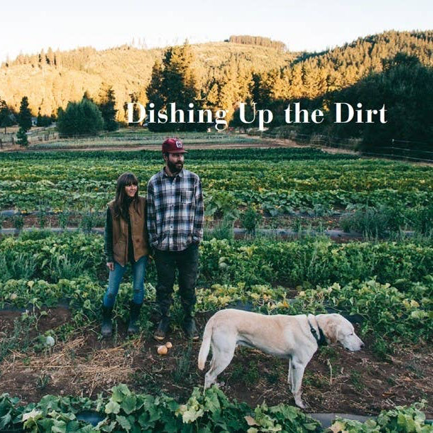 Two people and a dog standing in a garden with a building and trees in the background, and 'Fishing Up the Dirt' text overlay.