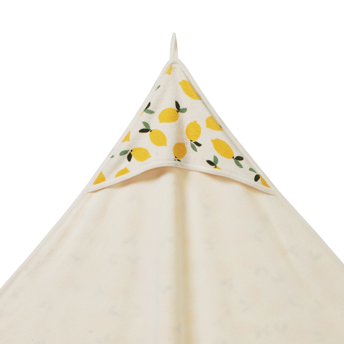 Beige towel with lemon pattern on a white background