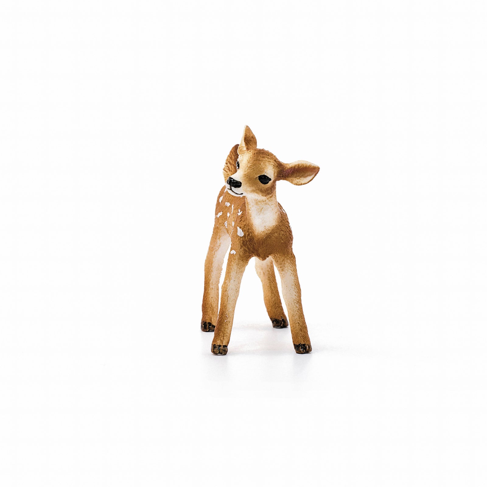 Deer figurine with brown and white fur on a white background
