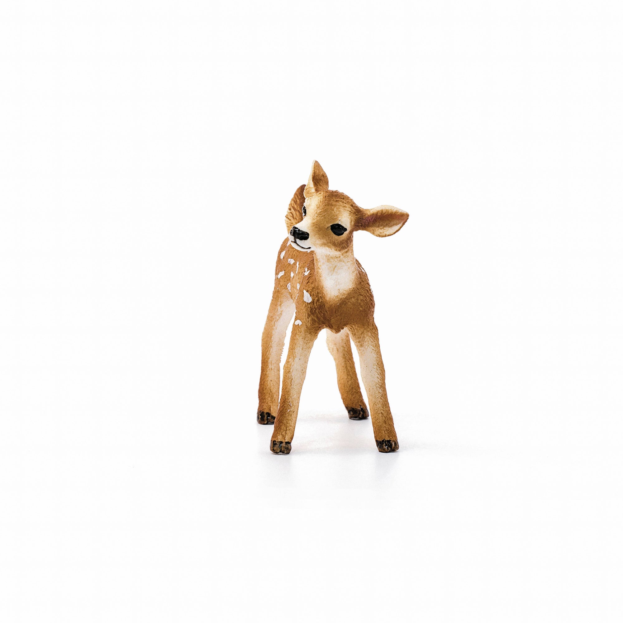 Deer figurine with brown and white fur on a white background