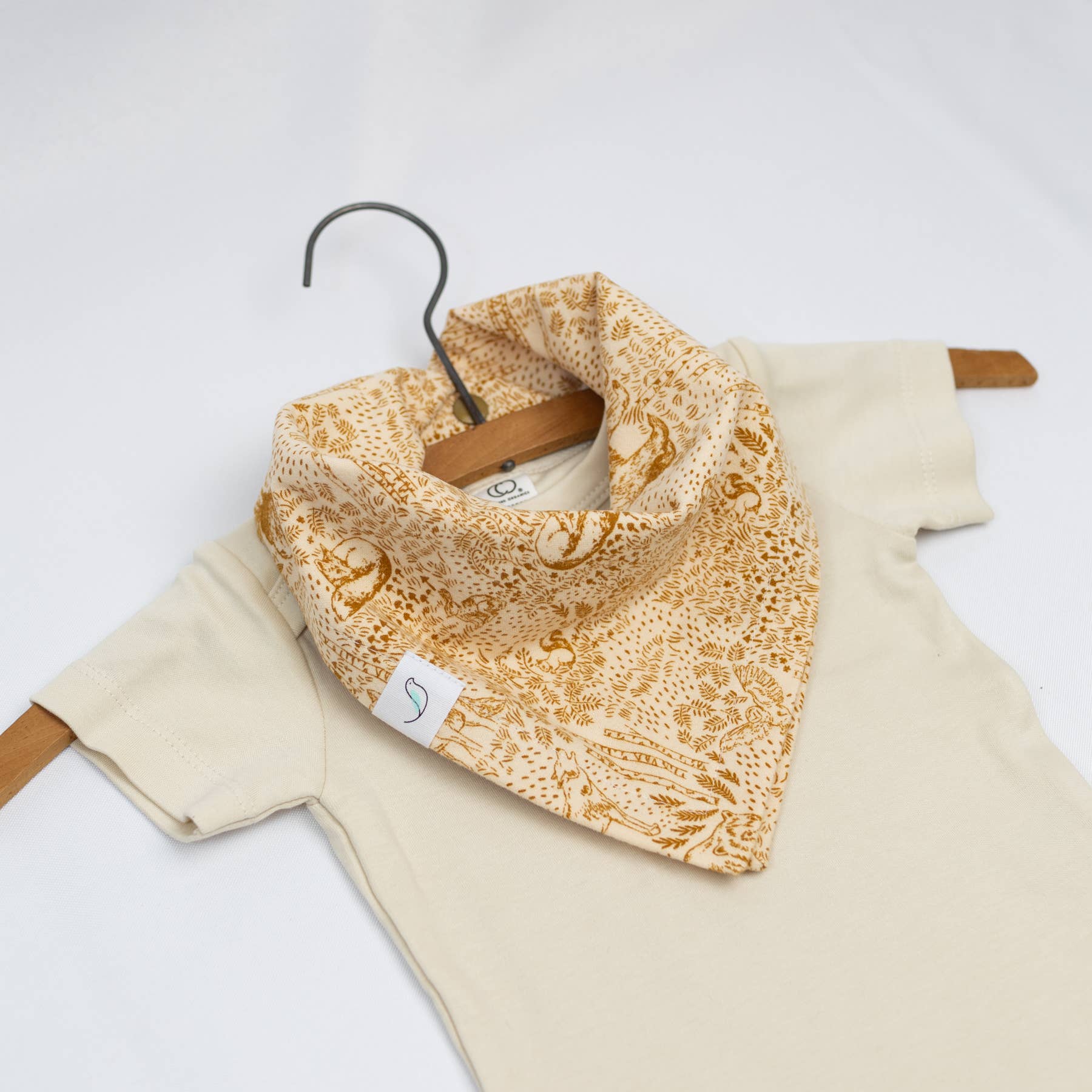 Yellow patterned bandana bib on a white background