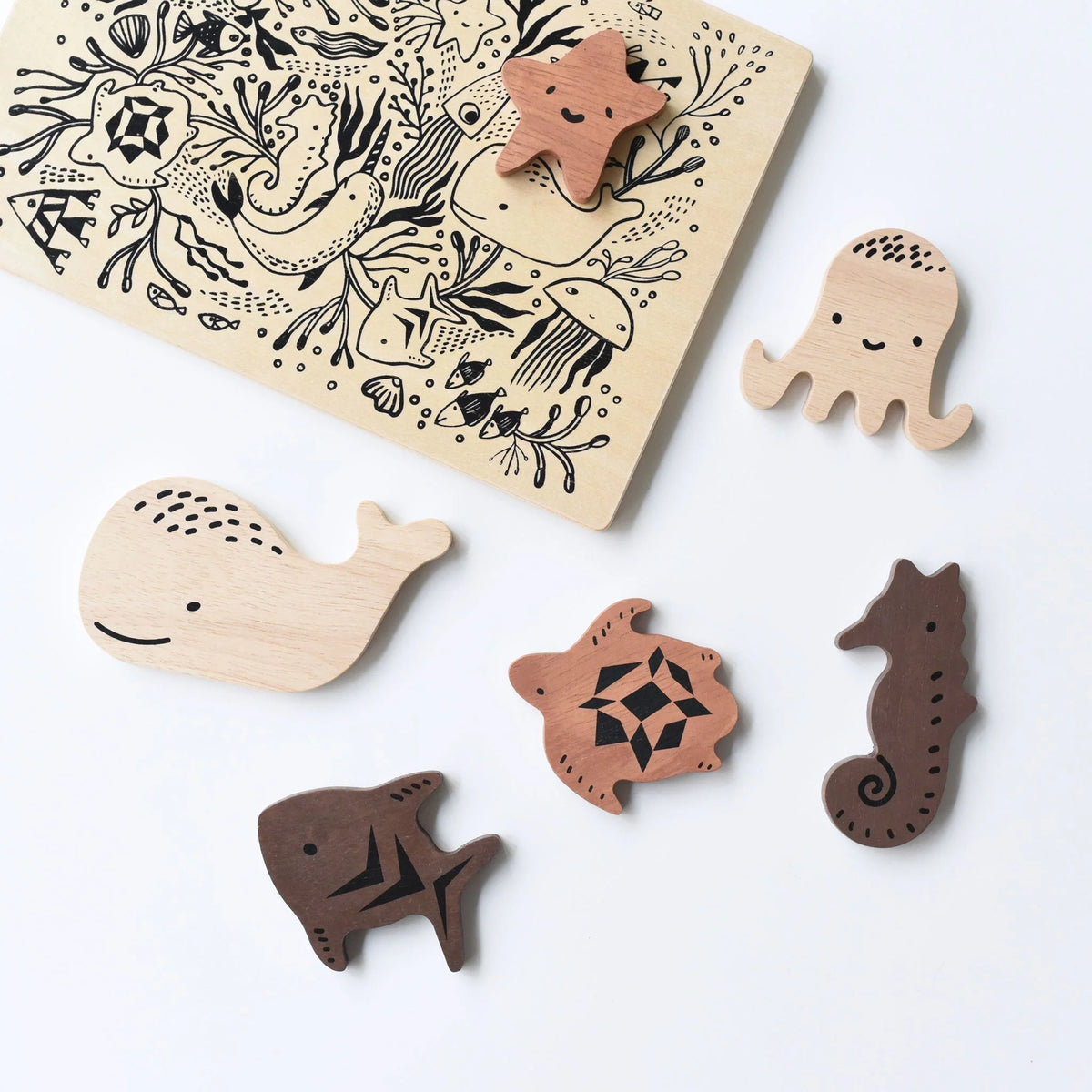 ocean themed puzzle pieces on picture puzzle board