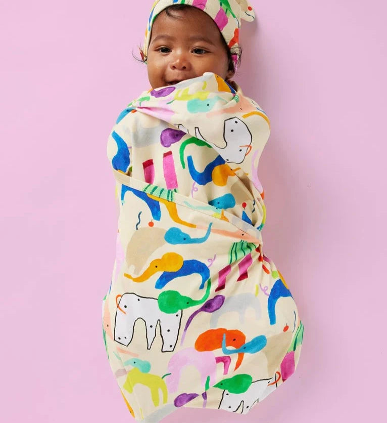 Baby swaddle packaging with Halcyon Night Happy Herd print