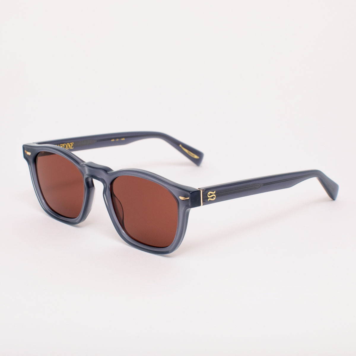 Sunglasses with a blue frame and brown lenses on a white background