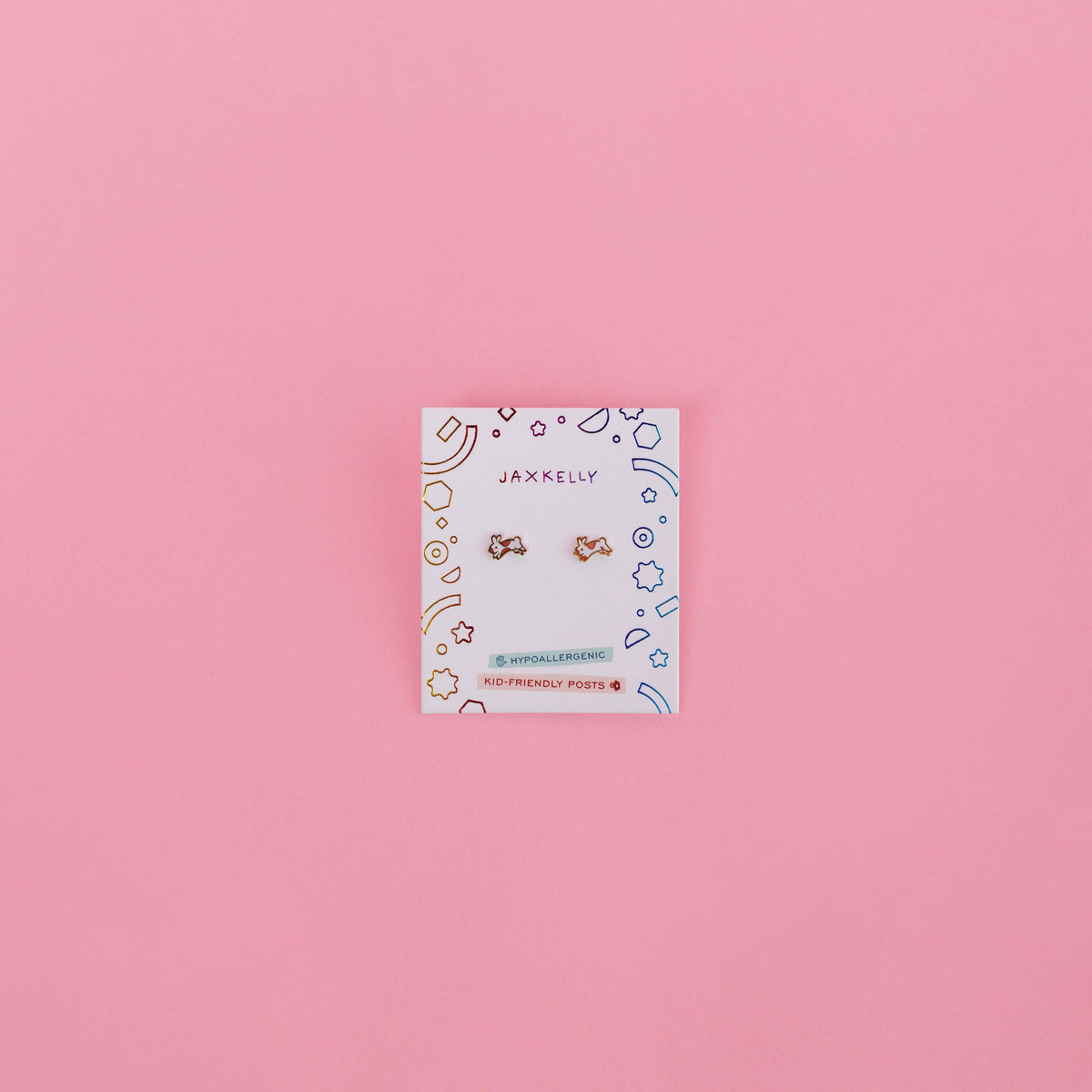 Jewelry card with earrings on a pink background