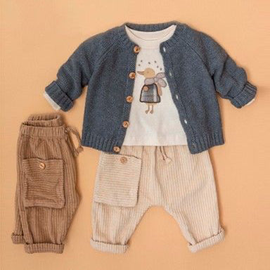 A baby boy's three-piece outfit set laid flat on a warm peach background. The set includes a blue-gray knit cardigan with brown buttons, a white t-shirt with a cartoon duck graphic, and beige corduroy pants.