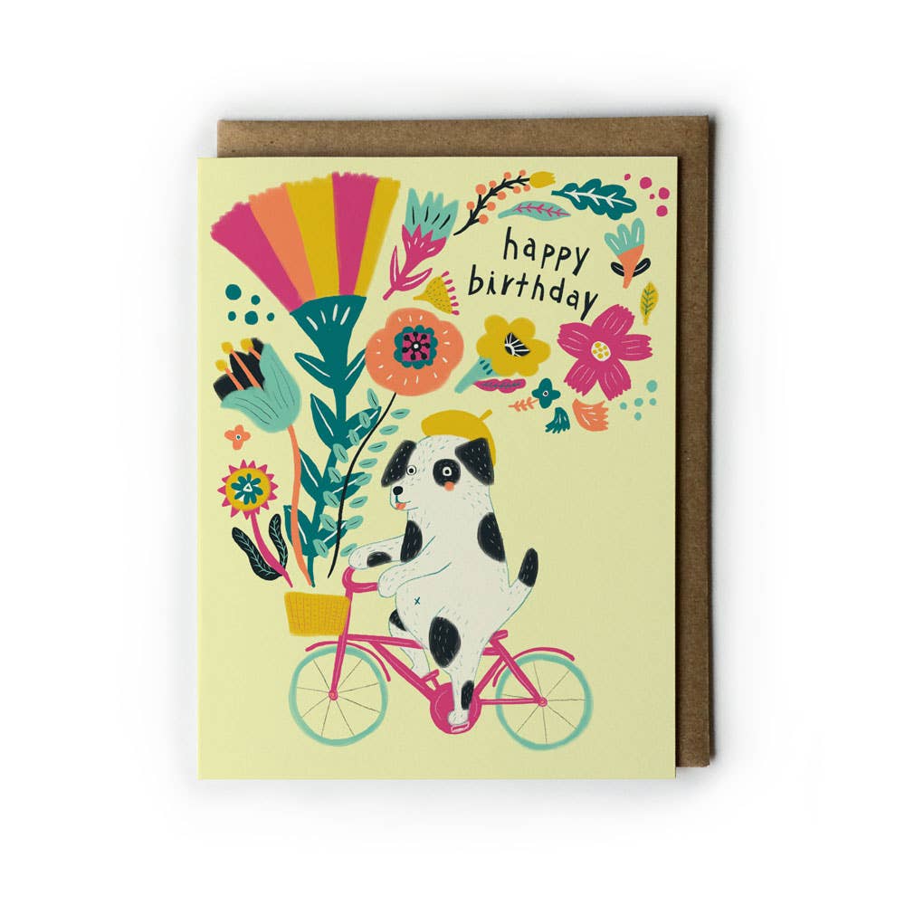 Birthday card with a dog on a bike and colorful flowers on a yellow background