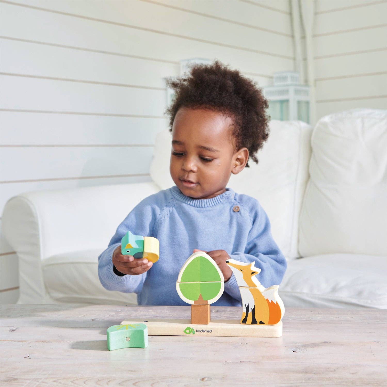 Wooden toy set with fox, tree, and bird on a white background