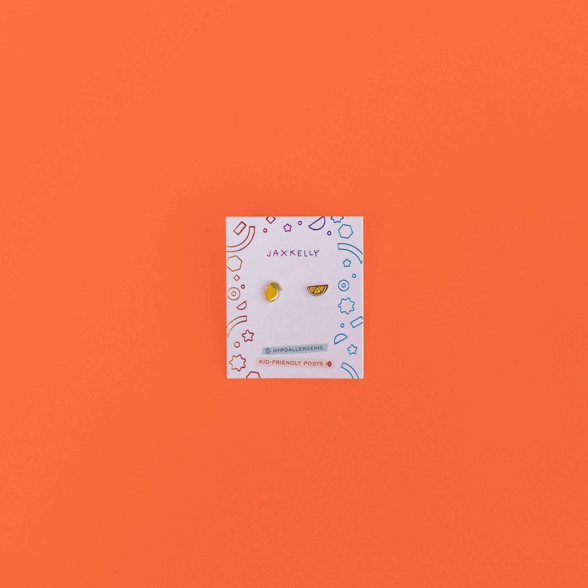 Jewelry card with earrings on an orange background