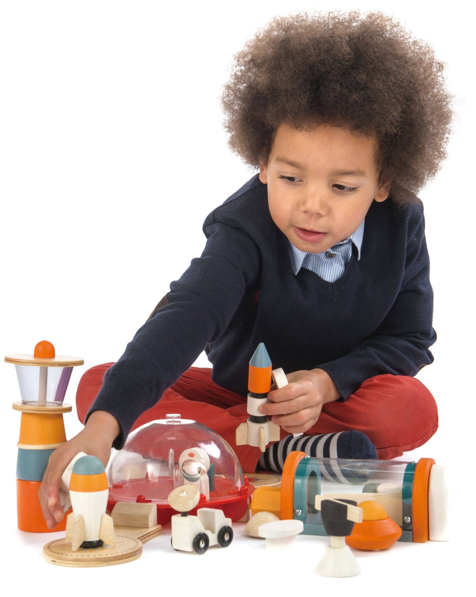 Wooden toy set with space-themed elements on a white background