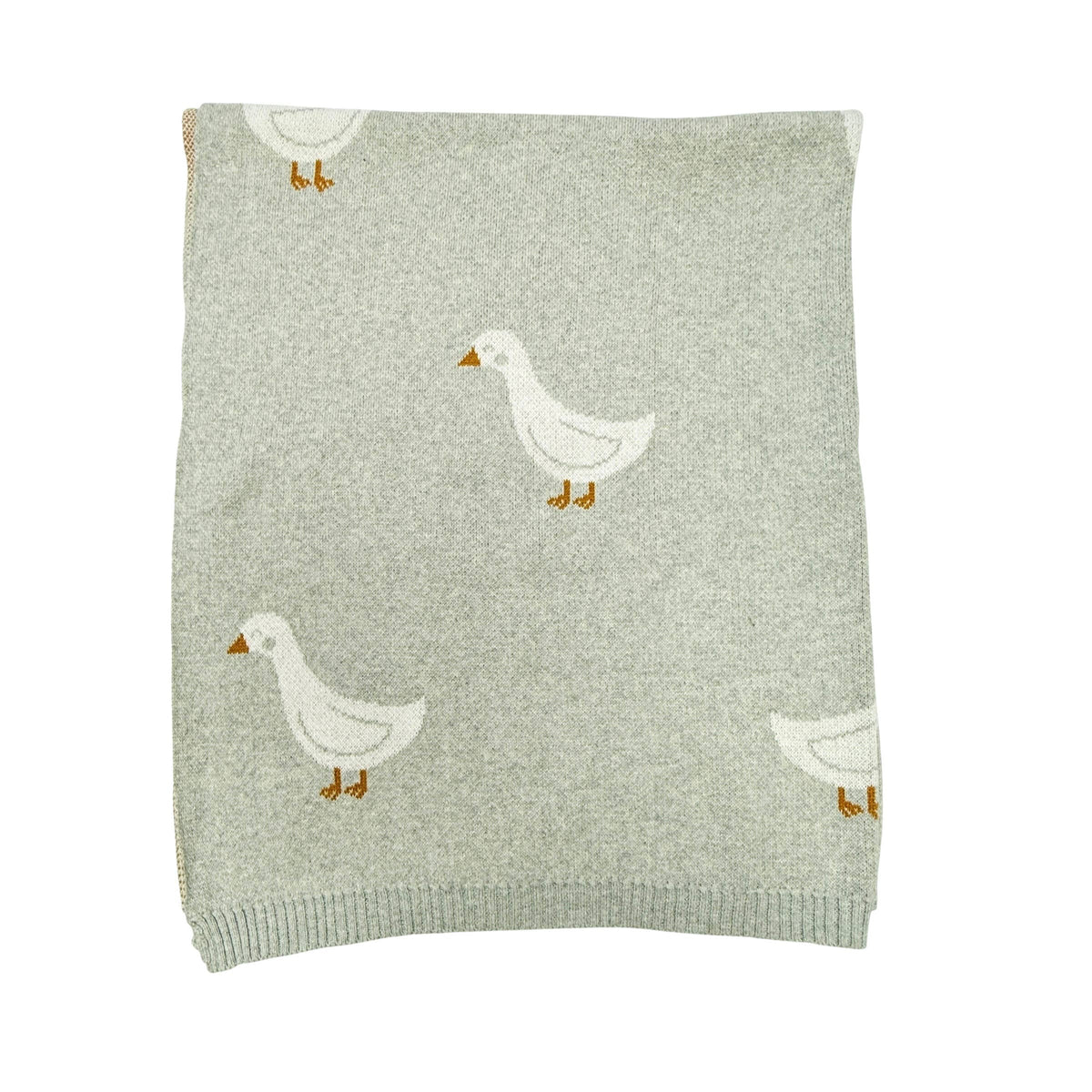 Knitted blanket with duck patterns on a white background