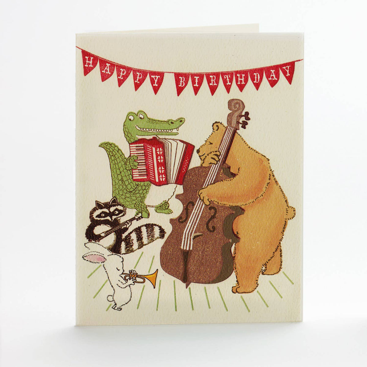 Birthday card with cartoon animals playing instruments and 'Happy Birthday' banner.