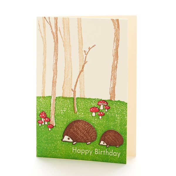 Birthday card with hedgehogs and mushrooms in a forest design