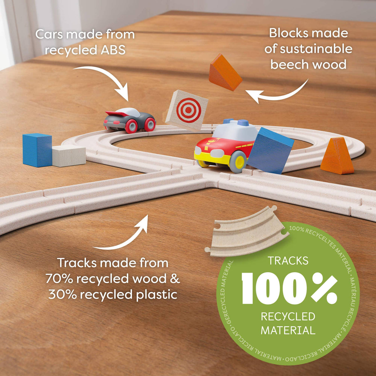Toy track set with cars and blocks on a wooden surface, highlighting eco-friendly materials.