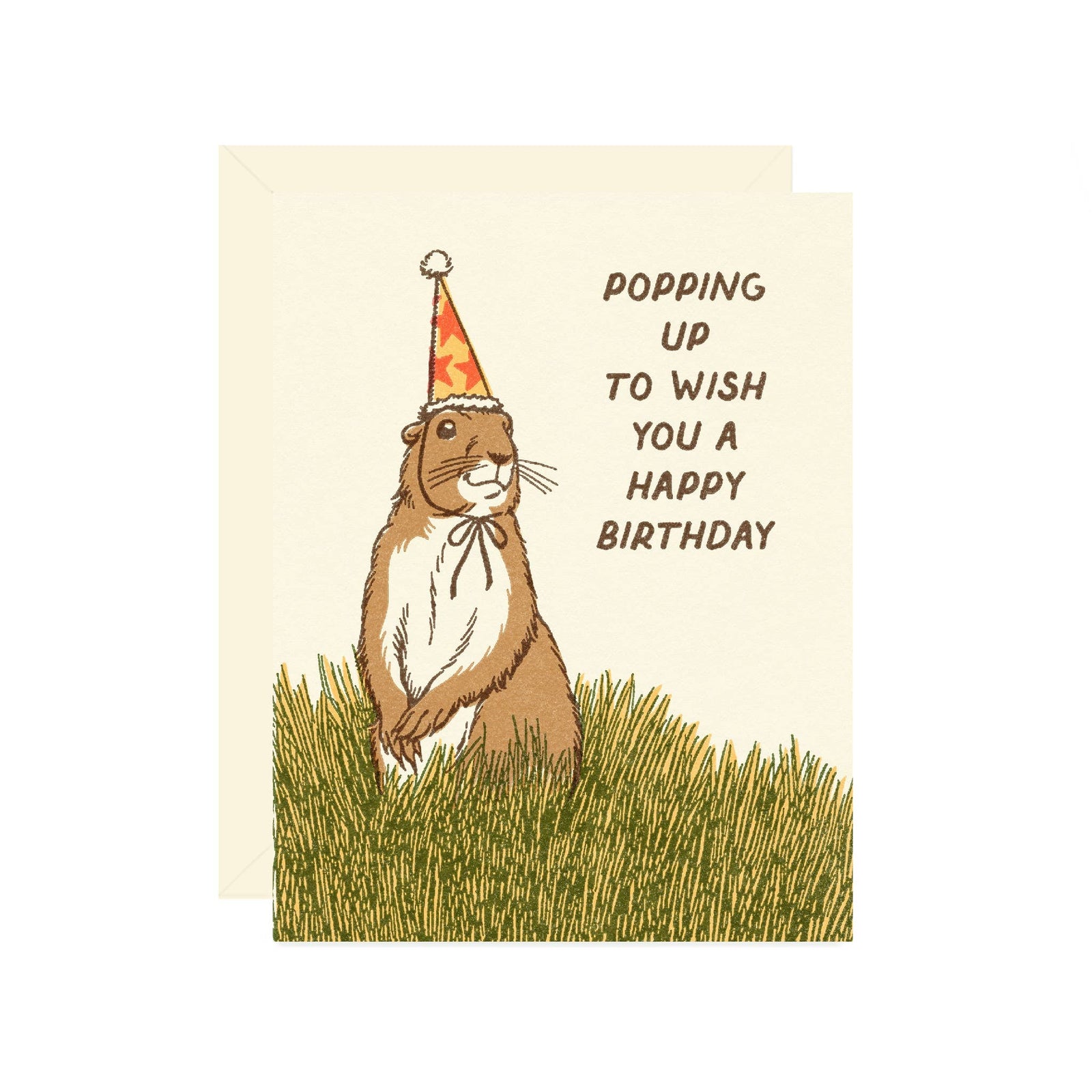 Greeting card with a groundhog wearing a party hat and text 'Popping up to wish you a happy birthday' on a grassy background.
