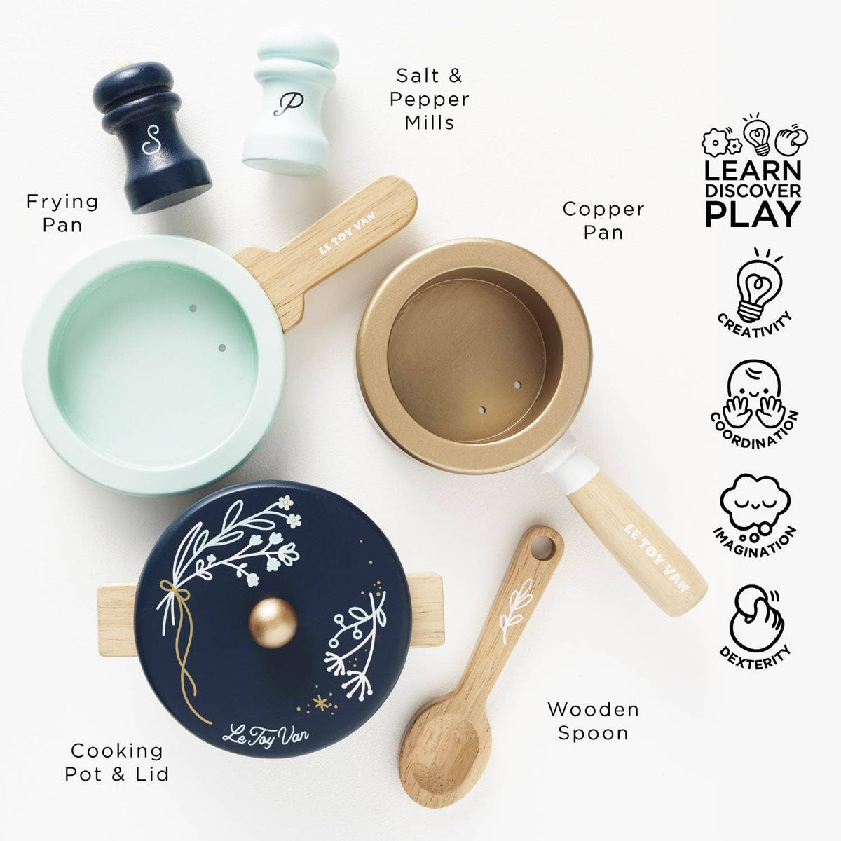 Set of children's cookware including a frying pan, salt and pepper mills, copper pan, cooking pot with lid, and wooden spoon on a white background.